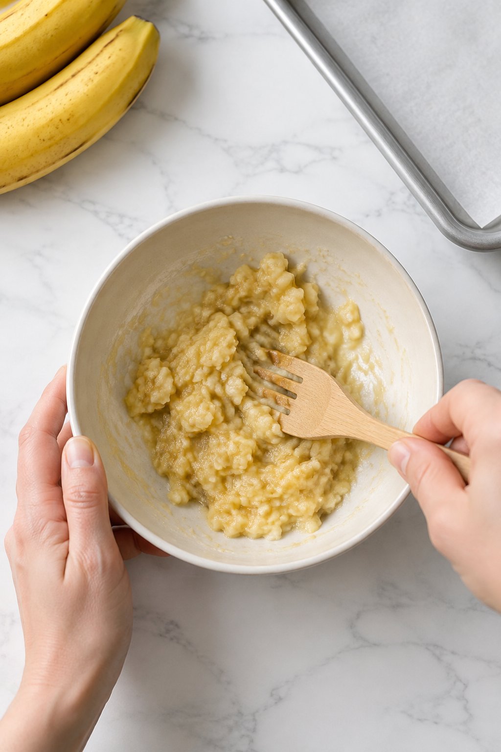 Mash the banana in a medium bowl until only small lumps remain. Easy Homemade Dog Pancakes dog treats prepared on a white marble counter with soft natural daylight.